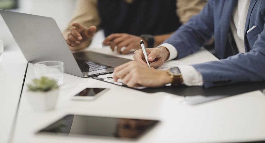 Consulting and Advisory Services Image - Two People Around a Computer